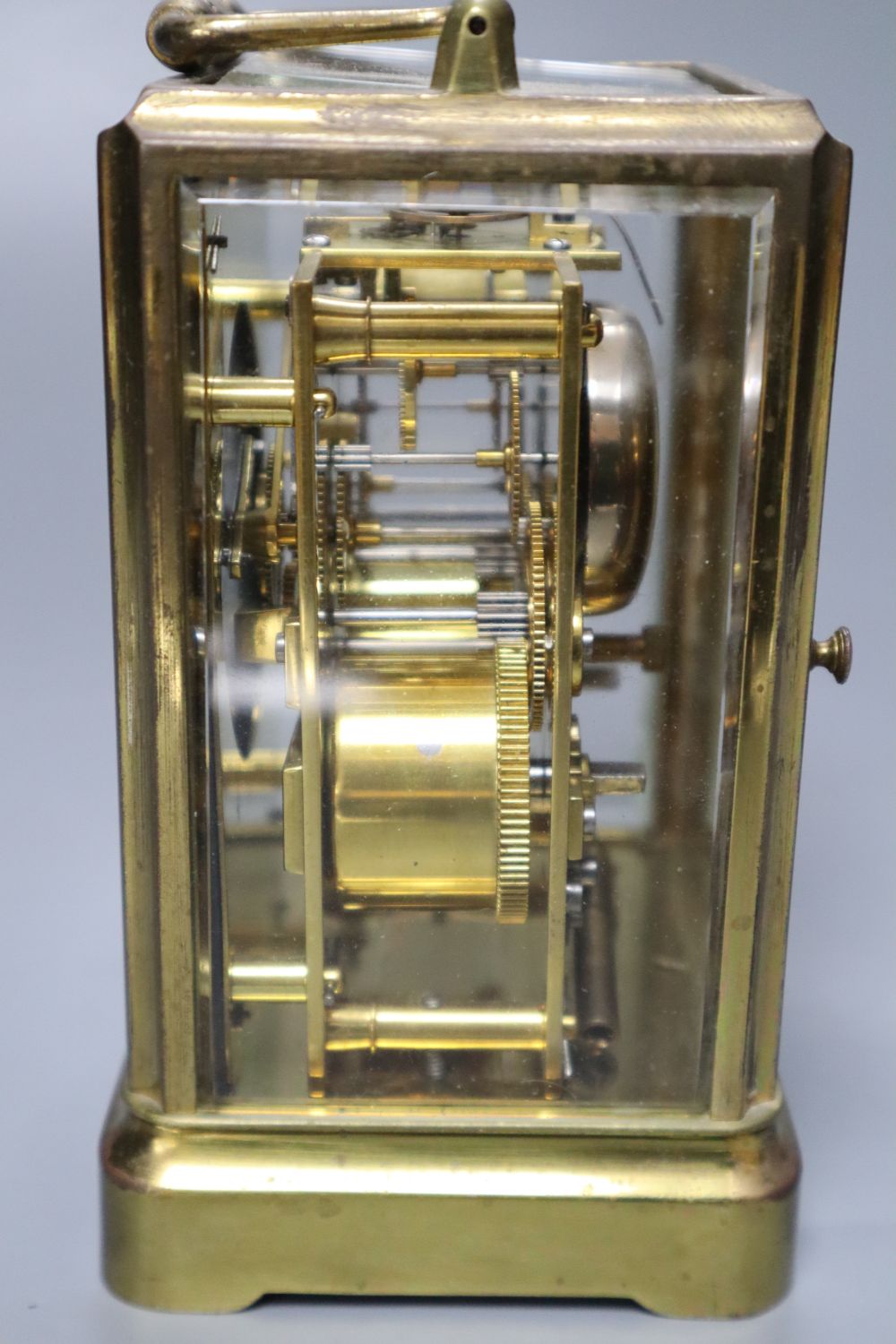 O. Berger, Paris. A carriage clock, with white enamel dial, Japy Freres movement striking on a bell, 19cm incl. handle